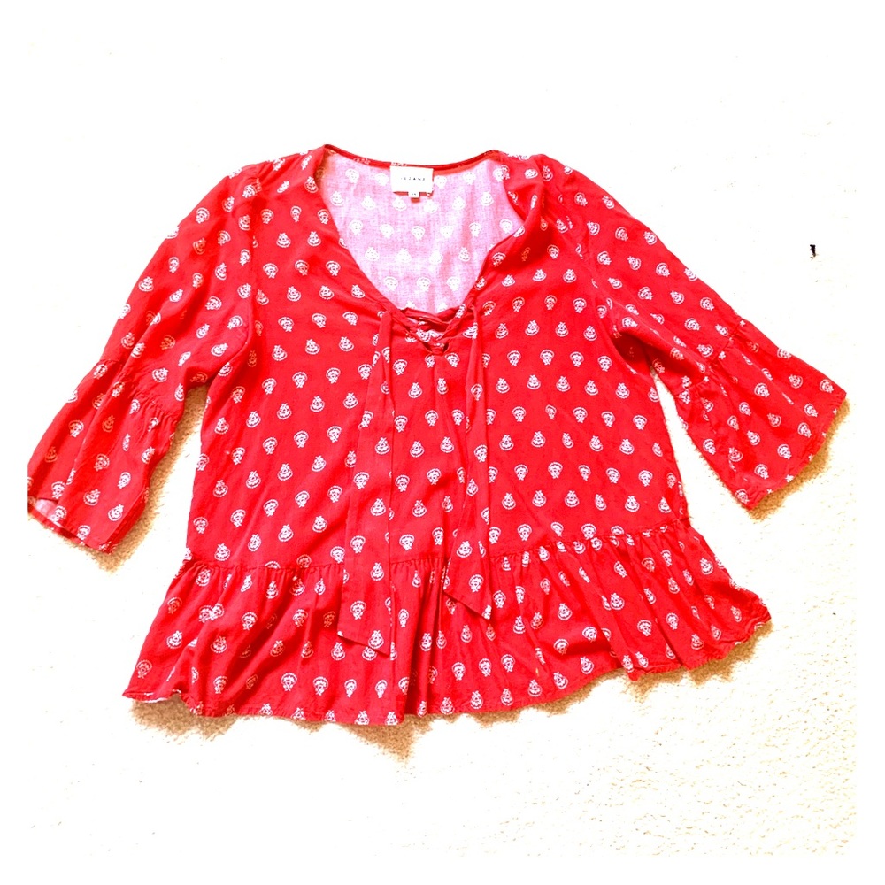 Red patterned blouse